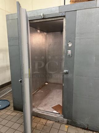Norlake 8'x8'x7' self-contained walk-in freezer box with floor, Copeland compressor, Norlake CPF150DC condenser. Door ajar.
