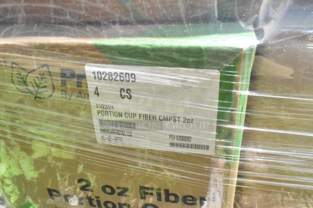 Plastic-wrapped boxes labeled "Portion Cup Fiber CMPS 2oz" by AmercareRoyal. New, scratch and dent condition.
