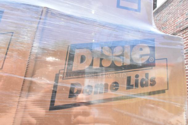 Boxes of Dixie D9550B Black Plastic Dome Lids wrapped in plastic. Some boxes marked as scratch and dent.