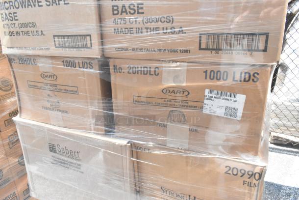 21 brand new scratch and dent boxes of to-go containers and lids, including Dart 1000 lids, wrapped in plastic film.