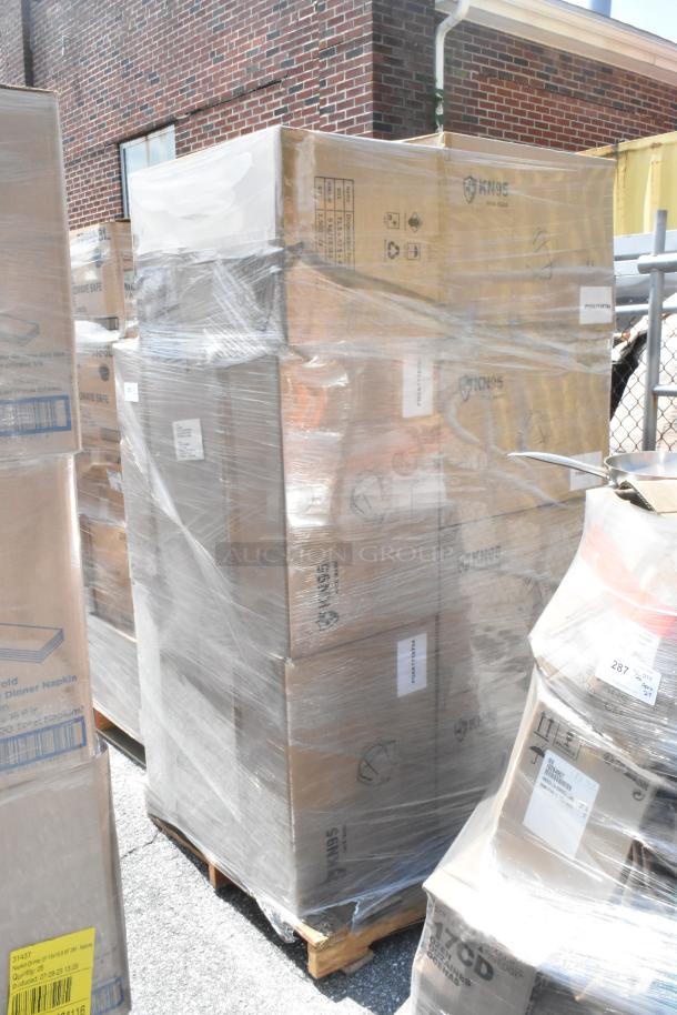 Pallet with 13 boxes of KN95 face masks, shrink-wrapped, labeled as "Scratch and Dent." New condition, ready for auction bidding.