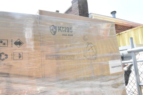13 boxes of KN95 face masks, brand new with minor scratches and dents. PO# A1718794 visible on large brown box.