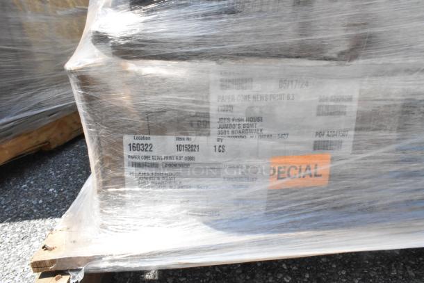 Plastic-wrapped pallet containing scratch and dent glassware items with labeled location and item details visible.
