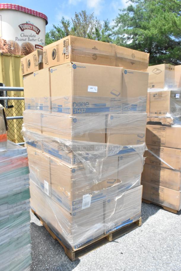 Pallet of Dixie boxes, wrapped in plastic, containing napkins and dome lids, new condition, labeled with 31437 and shipping details.