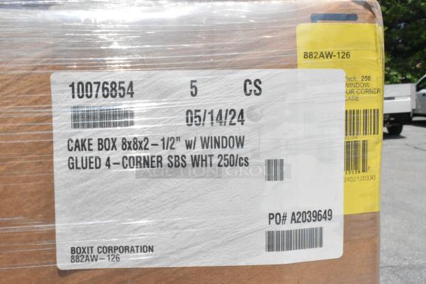 Box with label detailing 8x8x2-1/2" cake boxes, glued 4-corner, SBS white, 250 units per case. Shows date and PO number.