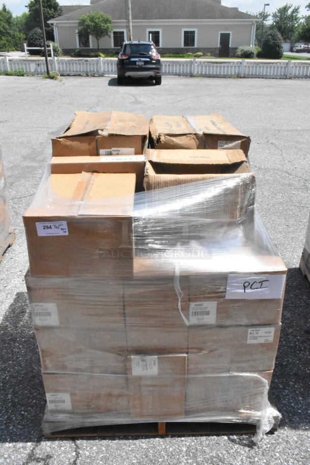 Alt text: Pallet with 26 sealed boxes labeled "PCI," containing scratch and dent napkins and platters. Boxes show minor wear.