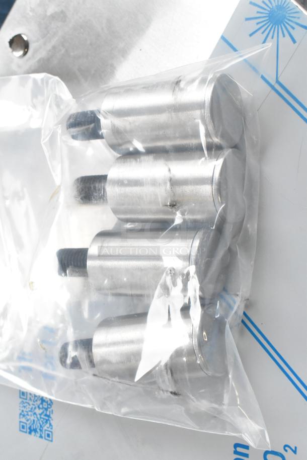 Five silver metal oven rack supports in a plastic bag. Part of Southbend oven model PCG50S/SD.