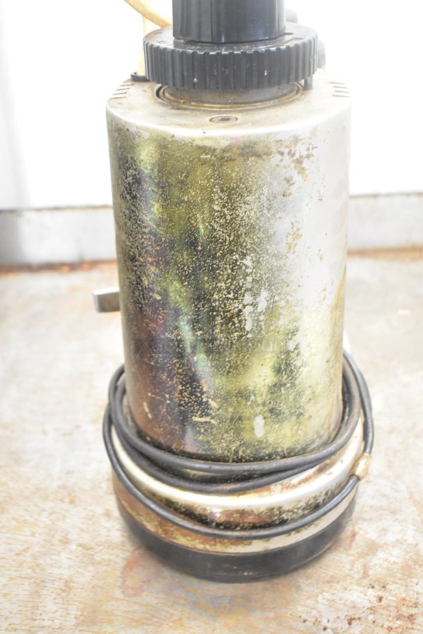 Rossi Metal Commercial Espresso Bean Grinder, 115V, 1 Phase. Shows wear and patina. Compact countertop design.