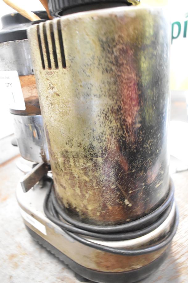 Rossi Metal Commercial Espresso Bean Grinder, 115V, 1 Phase, showing wear with some surface discoloration.