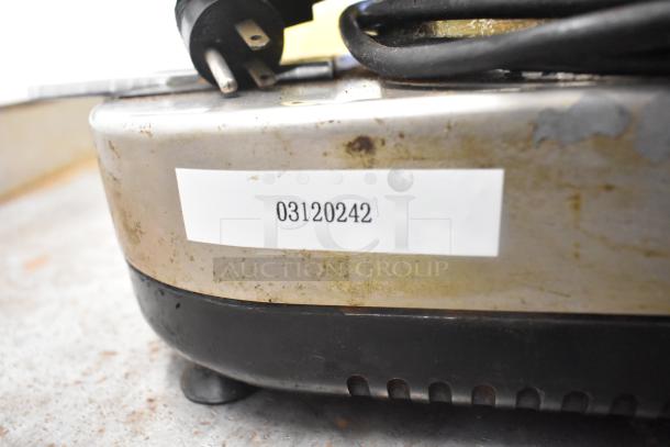Rossi metal commercial espresso bean grinder, countertop design, 115 volts, 1 phase, visible plug, wear visible, ID label 03120242.