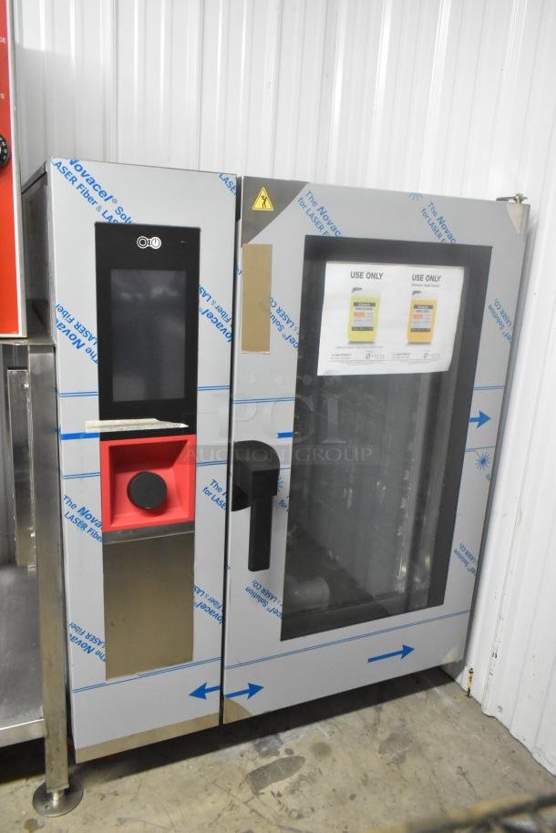 Brand new Blodgett AETG101R stainless steel combi convection oven, natural gas, with visible scratch and dent.