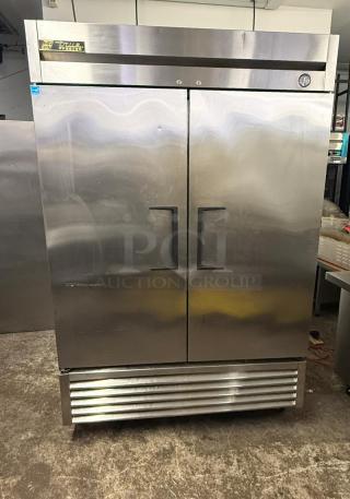 TRUE T-49F reach-in freezer, two-section, stainless steel, solid left/right hinge doors, excellent condition.