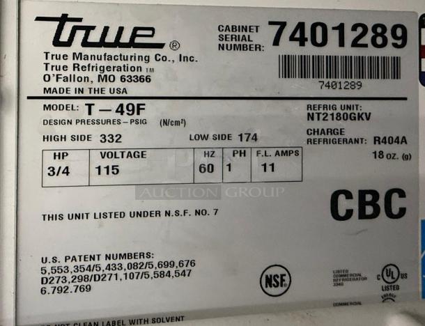 Label of True T-49F freezer with model, serial number, and specifications including voltage and refrigerant type.