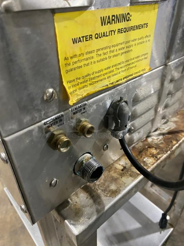 Vulcan stainless steel natural gas convection steamer, on legs, with water connections and warning label, includes undershelf.