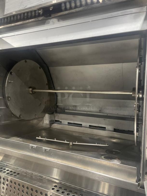 Hardt INFERNO3500 stainless steel double-stacked rotisserie oven, natural gas powered, programmable controls, on casters.