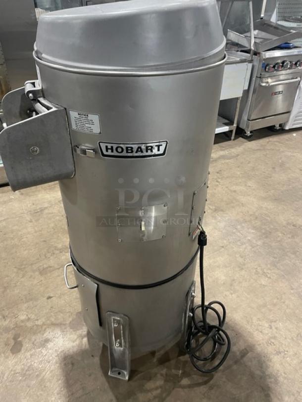 Hobart commercial heavy-duty electric potato peeler, model 6460C, 60 lb. capacity, 115V, on legs, with visible Hobart logo.