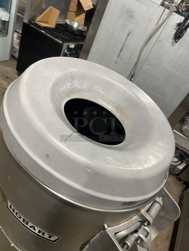 Hobart 6460C commercial 60 lb. potato peeler, electric-powered, on legs, working condition, visible Hobart logo.