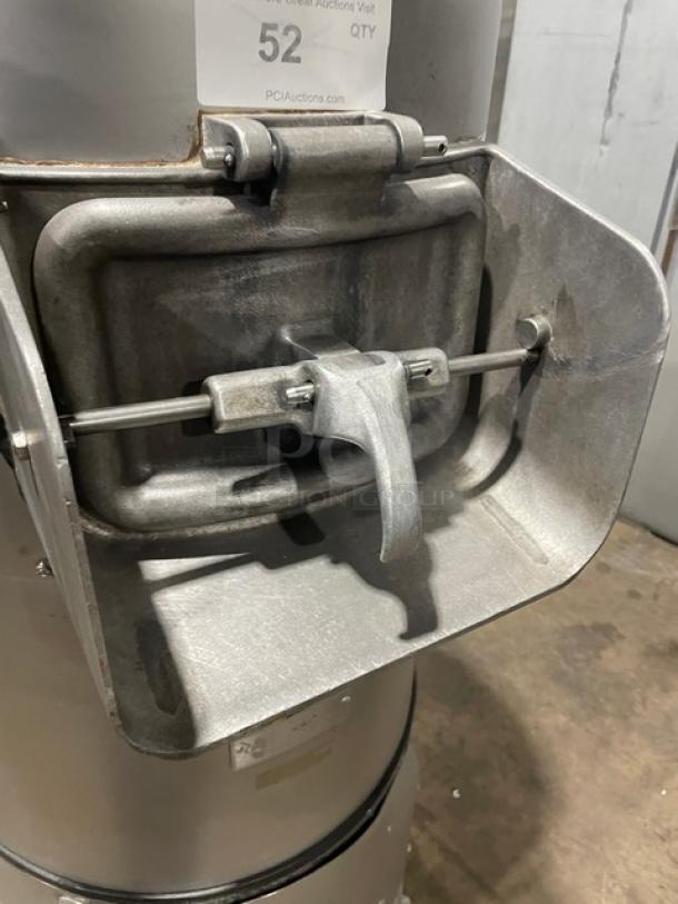 Hobart 6460C commercial potato peeler, 60 lb. capacity, electric, on legs, shows working condition label, sturdy metal design.