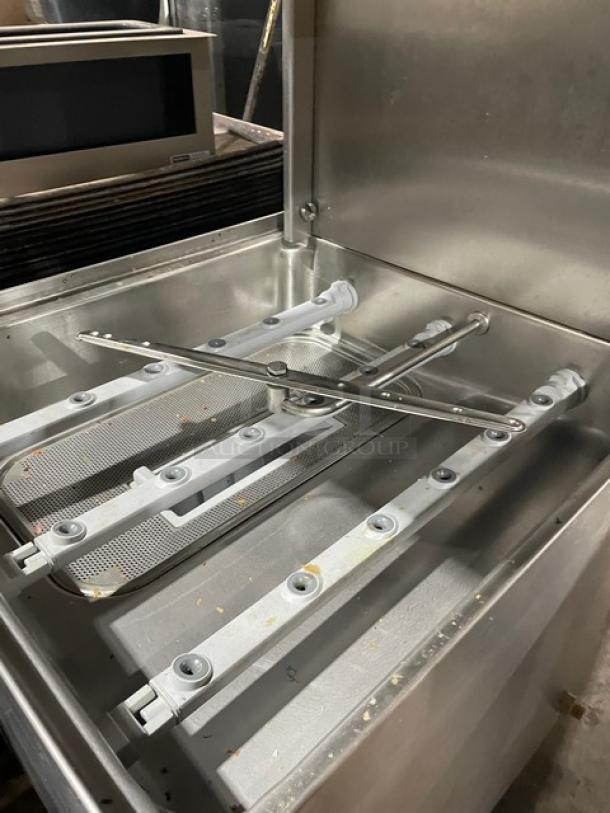 Winterhalter GS502 commercial dishwasher, stainless steel, electric-powered, pass-through, digital controls, on legs.
