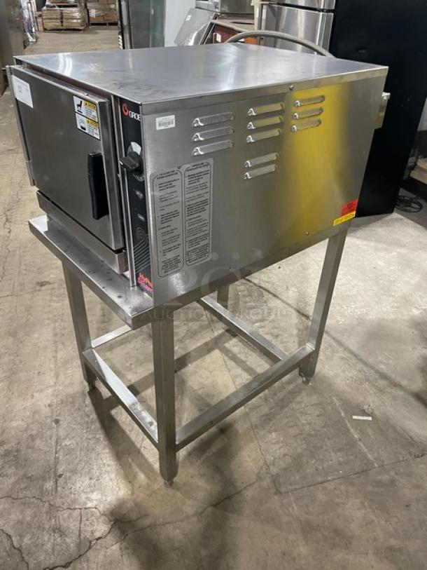 Groen HY-3E stainless steel countertop convection steamer on open base. With 3-pan capacity, built-in racks, 208V 3-phase.