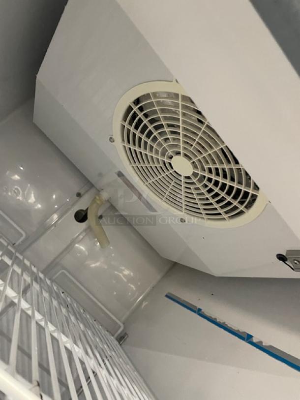 Maxx Cold MXM1-23R commercial refrigerator interior, showing poly-coated wire racks and cooling fan; Energy Star certified.