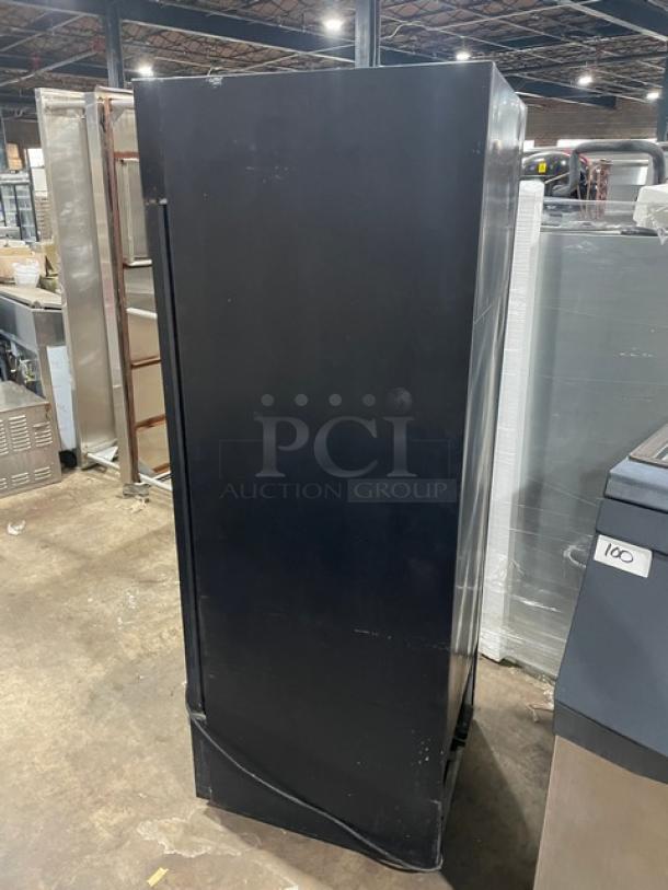 True Commercial GDM-23 black single glass swing door refrigerator, 115V, with poly coated wire racks, model SN: 1-4634407.