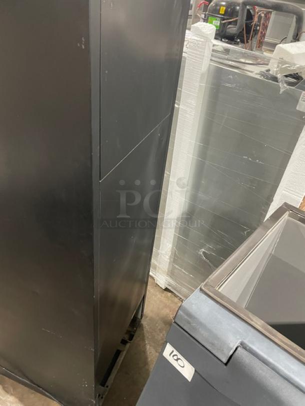 True GDM23 commercial black glass door refrigerator with poly-coated wire racks. Model SN: 1-4634407, 115V 1 Phase.
