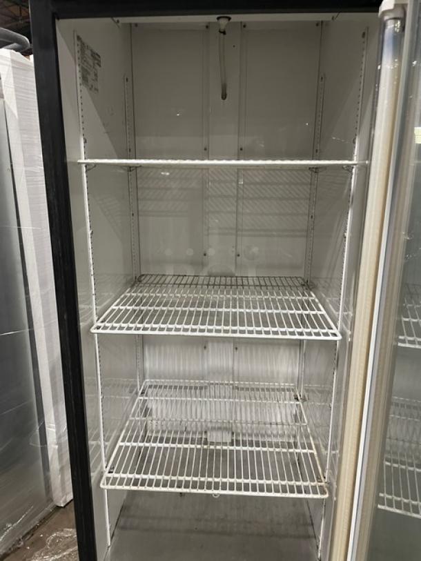 True GDM-23 commercial refrigerator with black single glass swing door, poly-coated wire racks, 115V, excellent condition.