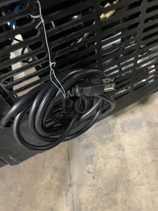 Avantco Model 178GDC23HCB merchandiser refrigerator power cord and rear vent, indicating electrical compatibility.