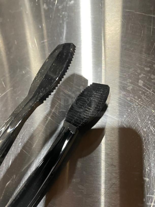 NEW Cambro Lugano Series black 9" flat grip tongs, Model TG9110, in pristine condition with textured gripping area.