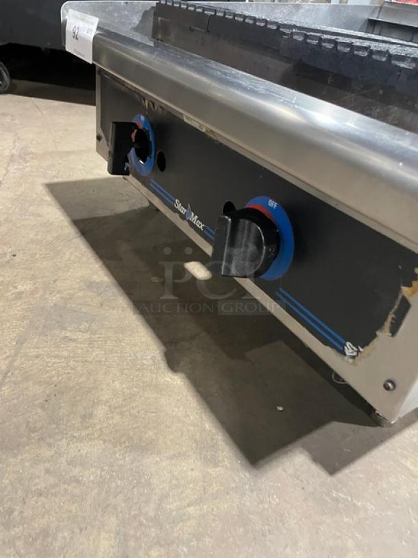 Stainless steel Star Max Series countertop char broiler, natural gas powered, with control knobs and visible wear.