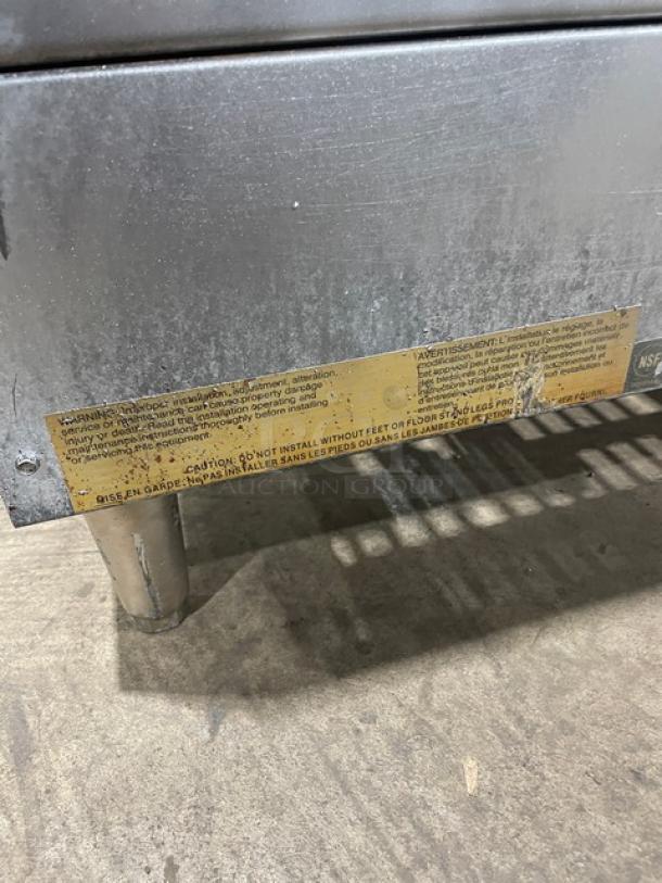 Star Max Series commercial stainless steel natural gas countertop char broiler, visible legs, warning label.