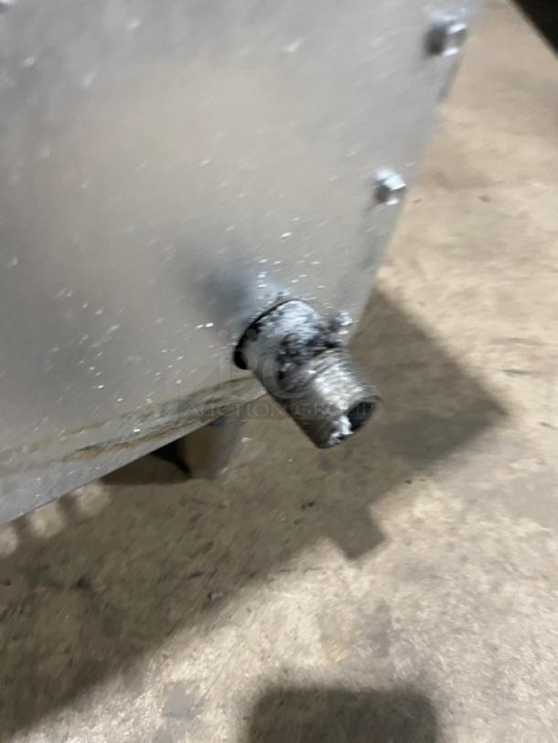 Commercial stainless steel countertop char broiler by Star, natural gas powered, on legs, used condition.