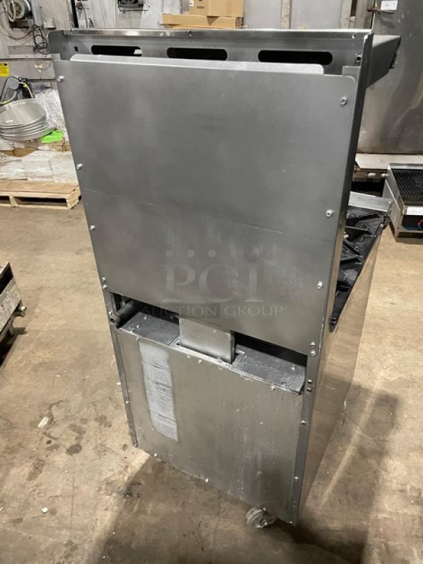 American Range stainless steel 4 burner gas range/oven combo. Includes backsplash, overhead salamander shelf, and casters.