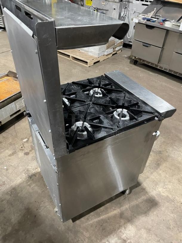 American Range commercial stainless steel 4-burner range/oven combo, with backsplash, salamander shelf, and casters.