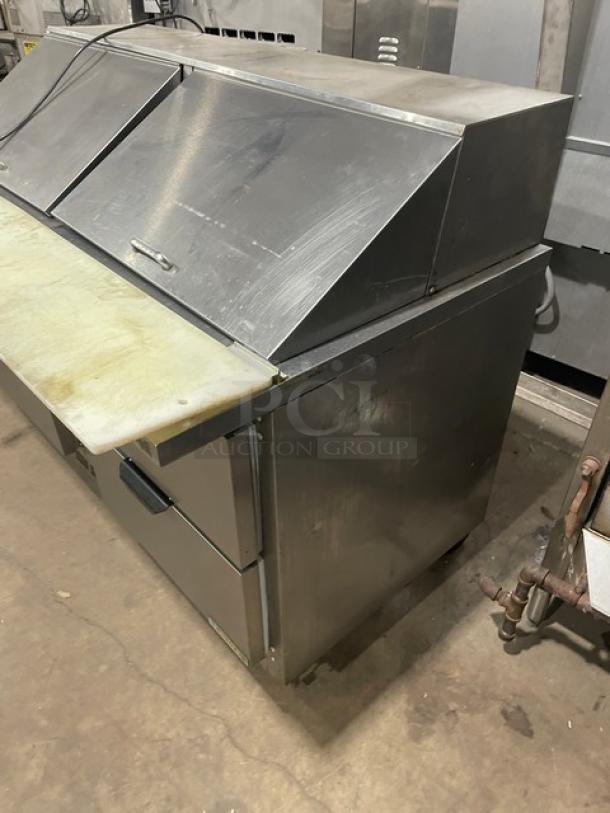 Beverage-Air stainless steel 4-drawer refrigerated prep table, model SPED60-24M-4, with cutting board, on casters.
