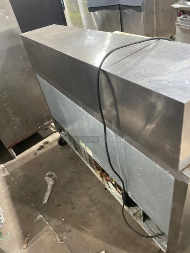 Beverage-Air Stainless Steel 4 Drawer Refrigerated Prep Table, Model SPED6024M4, with cutting board, SN: 12005633, on casters.