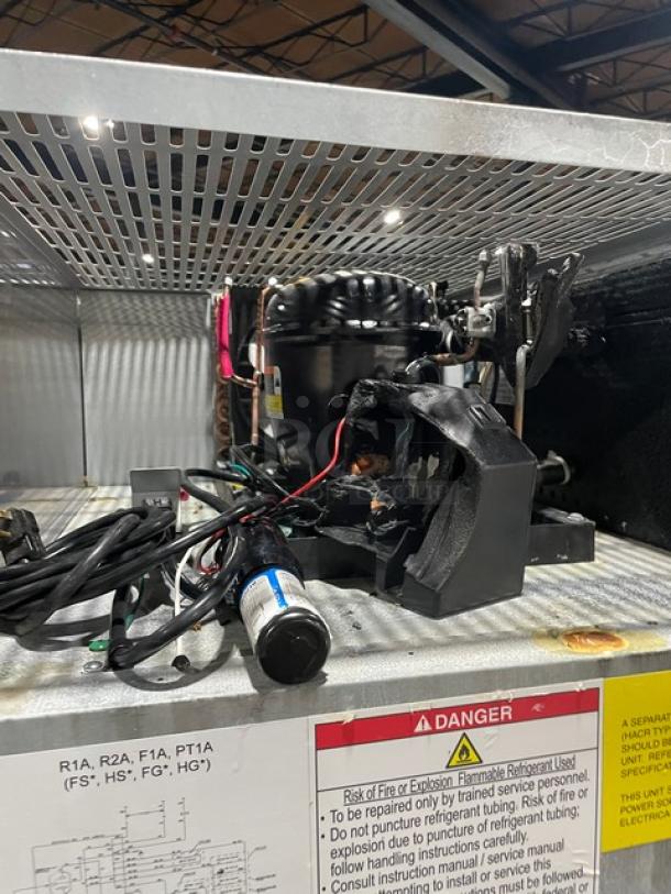 Hoshizaki R2A-FS commercial stainless steel refrigerator components, showing interior wiring and compressor.