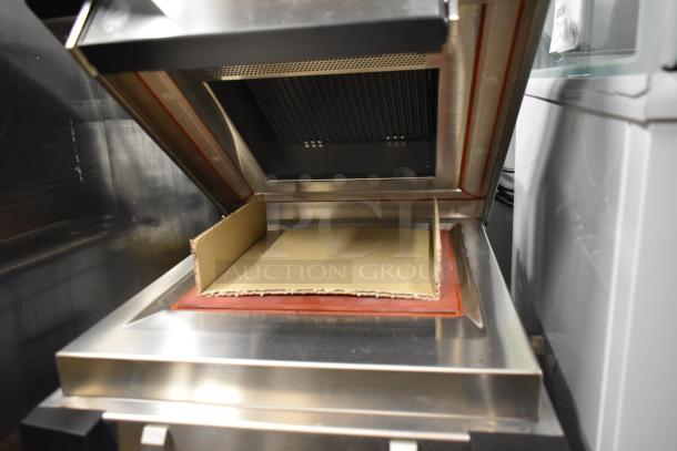 2018 Electrolux HSPP3RPRS stainless steel commercial countertop panini press, 208 volts, 1 phase, open with cardboard inside.