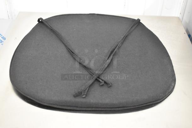 Brand new Lancaster Table & Seating black chair cushion, model 164CUSHVYBK1, with ties for secure fit. Scratch and dent item.