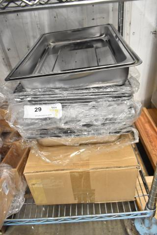 6 brand new stainless steel drop-in chafer bins with lids, slight scratches. Includes box of 6 folding chafer frames.