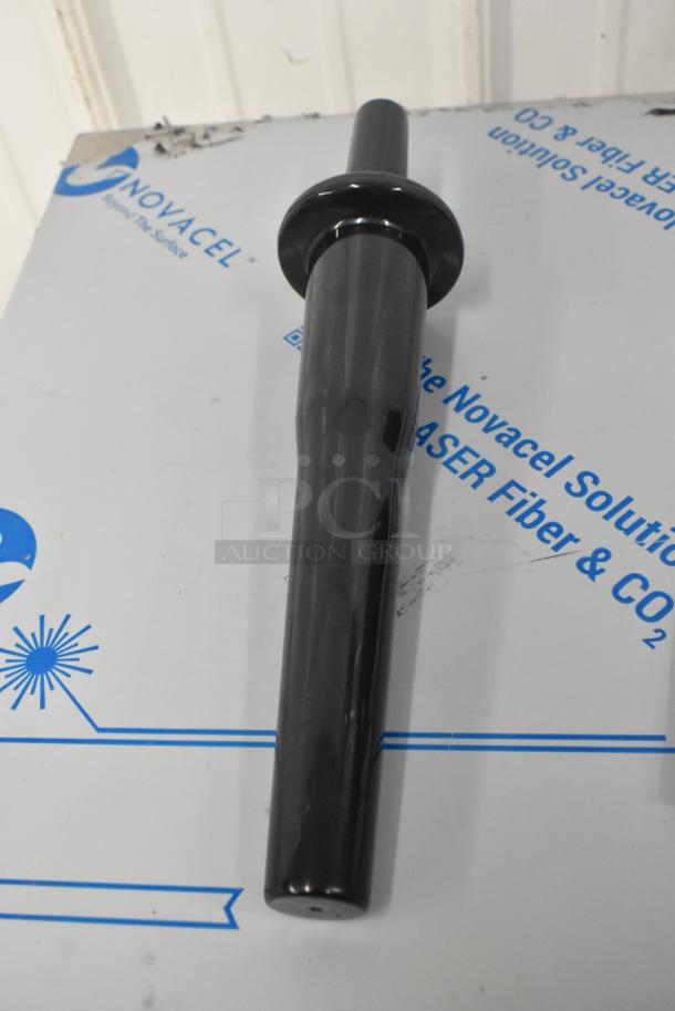 Alt Text: Black tamper tool for Avantco 928BL2T64 blender on Novacel protective material.