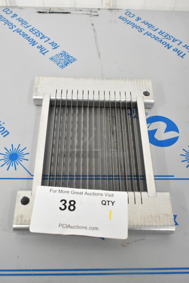 Brand new metal slicing blade with minor scratches, dented edges. Includes auction tag, item 38.