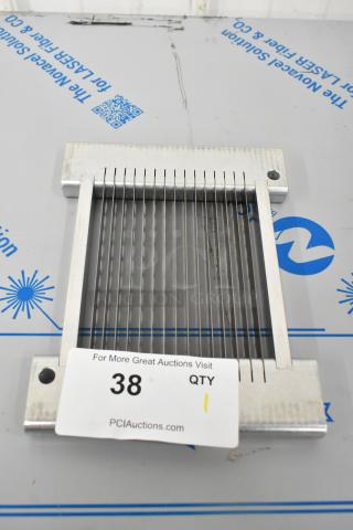 Brand new metal slicing blade with minor scratches, dented edges. Includes auction tag, item 38.