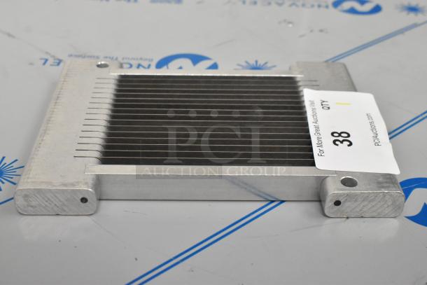BRAND NEW SCRATCH AND DENT! Metal slicing blade with multiple parallel blades, slight imperfections. Auction tag visible.