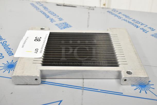 Brand new metal slicing blade, scratch and dent condition, with multiple sharp teeth and two mounting holes; labeled "38 QTY."
