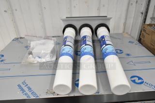 BRAND NEW SCRATCH AND DENT! OceanLoch L3 Triple Water Filtration System, with Oceanloch-L3 cartridges, outlet pressure gauge, 1-micron rating, 5 GPM, slight scratches visible.