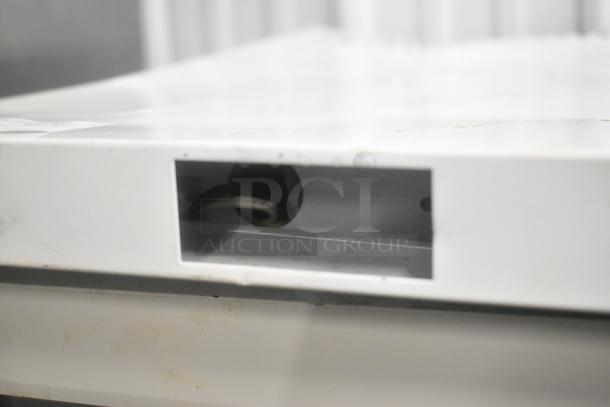 SG Merchandising MDH05-SSGD mini cooler metal frame, close-up of back panel connection port, used condition.