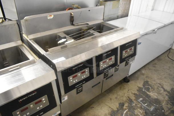 Henny Penny OFG-323 Stainless Steel Commercial Floor Style Natural Gas Powered 3 Bay Deep Fat Fryer w/ Filtration System on Commercial Casters. 255,000 BTU. - Image 2 of 14