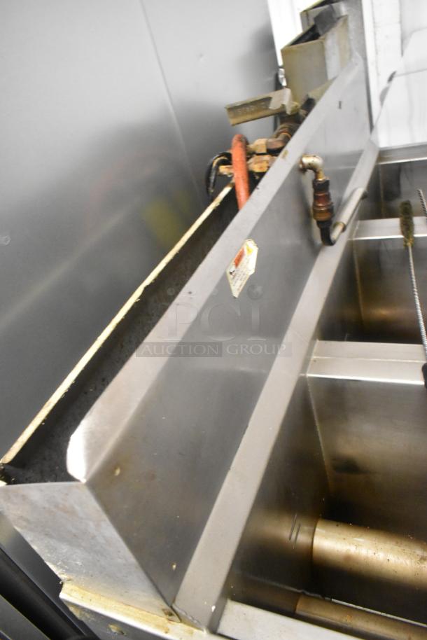 Henny Penny OFG-323 Stainless Steel Commercial Floor Style Natural Gas Powered 3 Bay Deep Fat Fryer w/ Filtration System on Commercial Casters. 255,000 BTU. - Image 13 of 14